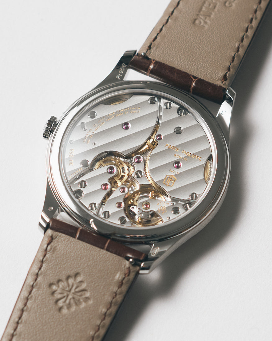 The intricate movement can be seen through the sapphire crystal case back.