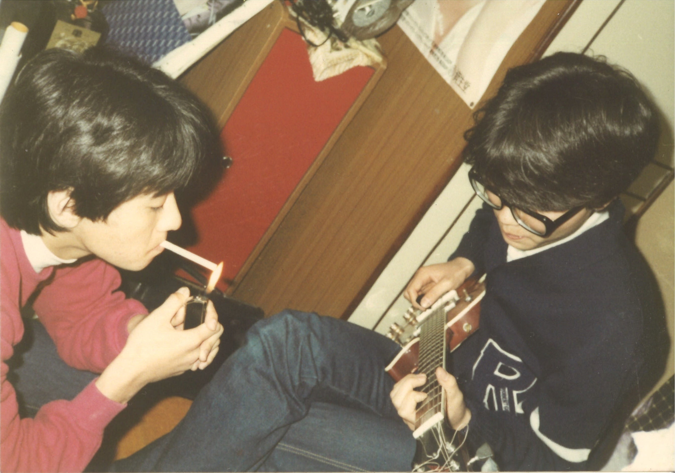 He plays the guitar in his room. He thought about playing an instrument, but said, 