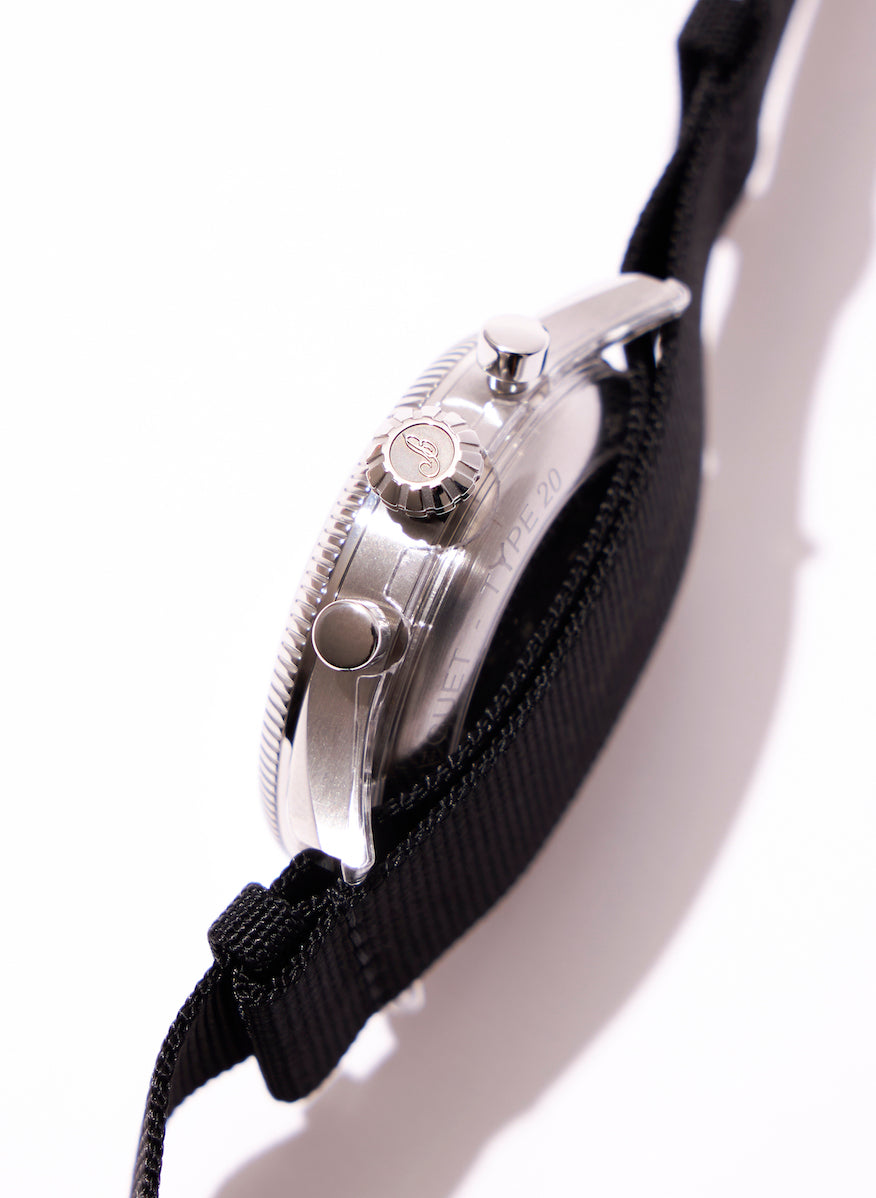 The crown is pear-shaped, reminiscent of the original Type 20, and is engraved with the brand's initials.