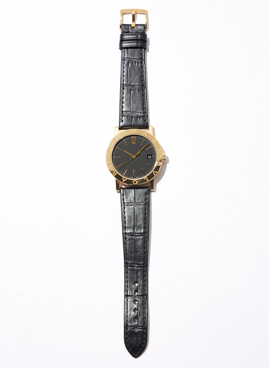 The 38mm case is crafted from yellow gold and is complemented by a black alligator strap.