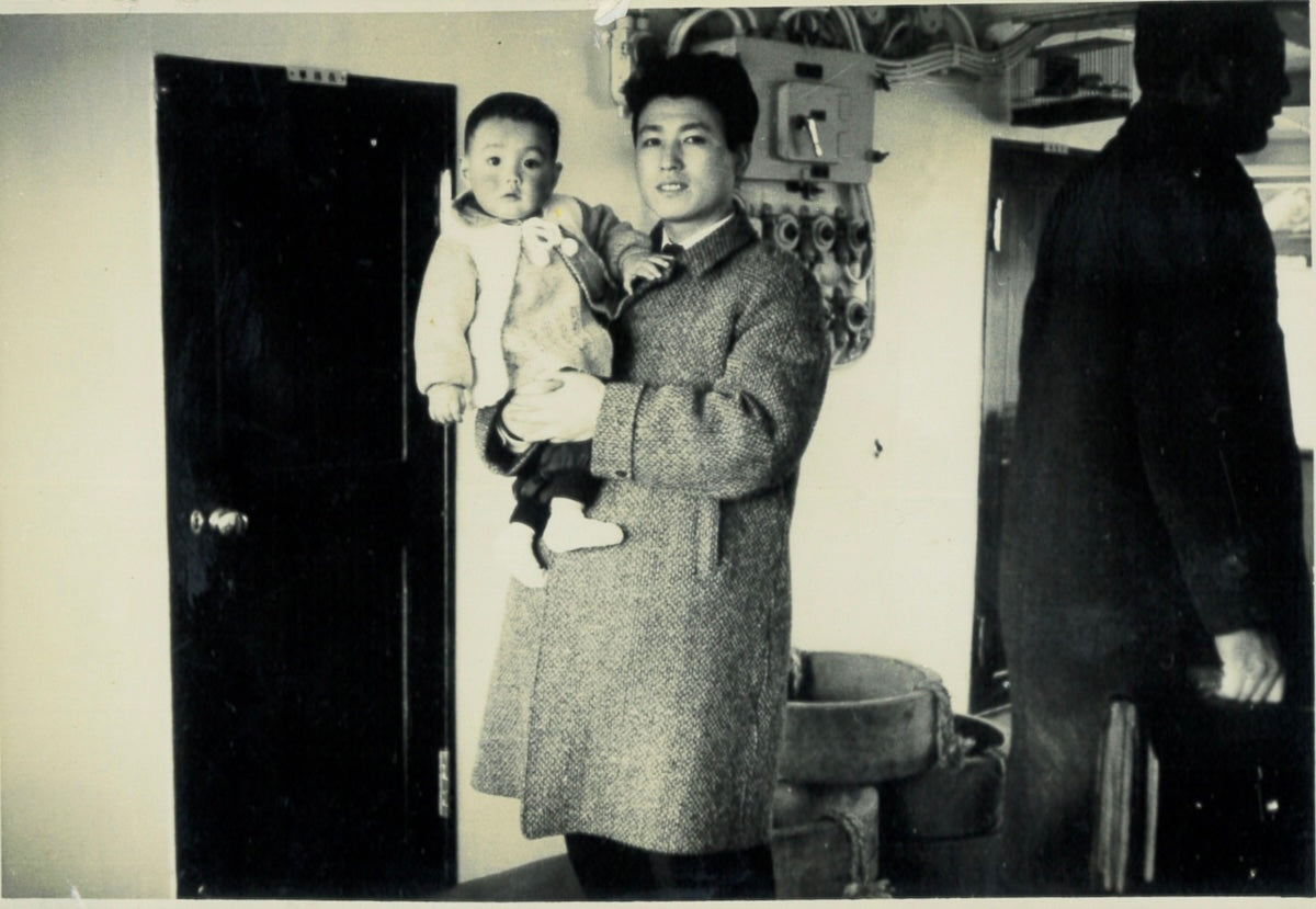 Now in the arms of my late father.