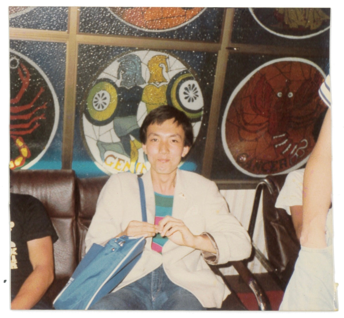 The silk jacket was purchased from Charters in London, and the multi-border marine T-shirt underneath was purchased from Paper Moon. The pants were from Fiorucci, which was popular at the time. The bag was a sample of an airline novelty item given to everyone on the Do! Family company trip to Hong Kong.