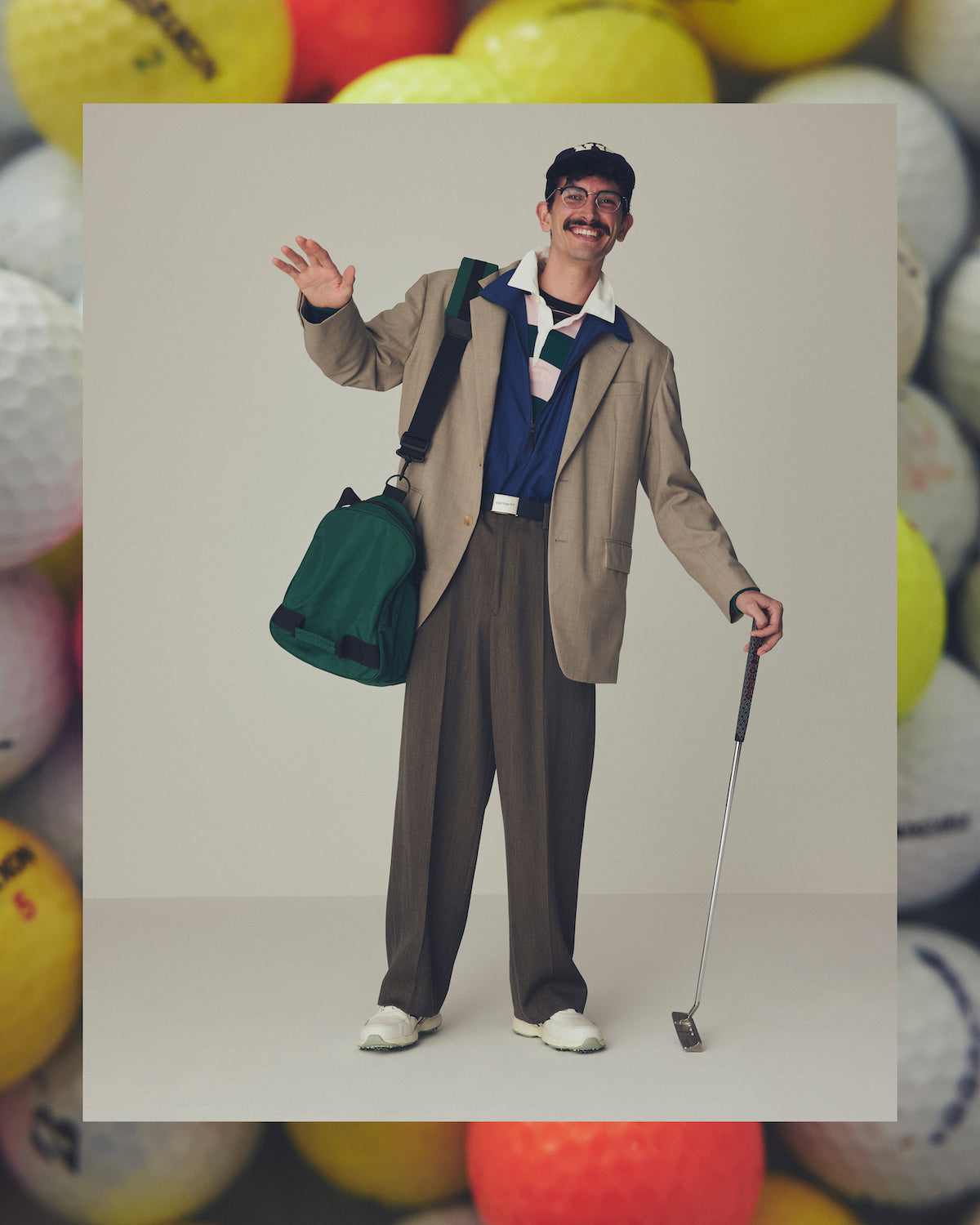 〈イレーヴ〉ジャケット ¥83,600、パンツ ¥53,900（ともにイレーヴ Tel. 03-5785-6447）、〈ゴールドウイン〉アノラック ¥33,000（ゴールドウイン カスタマーサービスセンター Tel. 0120-307-560）、〈メゾン エ ヴォヤージュ〉ラガーシャツ ¥33,000（メゾン エ ヴォヤージュ麻布台ヒルズ店 Tel. 03-5797-8515）、〈ノア〉Tシャツ ¥22,000（ノア クラブハウス Tel. 03-5413-5030）、〈ポロ ラルフ ローレン〉帽子 ¥17,600（ラルフ ローレン Tel. 0120-3274-20）、〈E5 アイヴァン〉メガネ ¥58,300（アイヴァン PR Tel. 03-6450-5300）、〈カーハート WIP〉ベルト ¥7,150（カーハート WIP シブヤ Tel. 03-3770-9810）、〈ビームスプラス〉バッグ ¥41,800（ビームス プラス 原宿 Tel. 03-3746-5851）、〈タイトリスト〉パター ¥60,500（アクシネット ジャパン インク Tel. 0120-935-325）