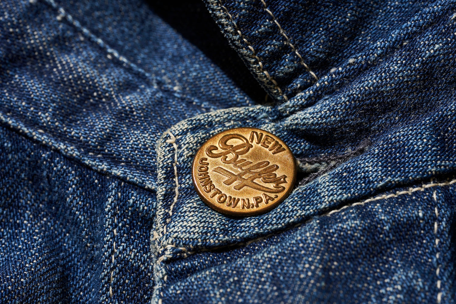 The button features the brand name, 