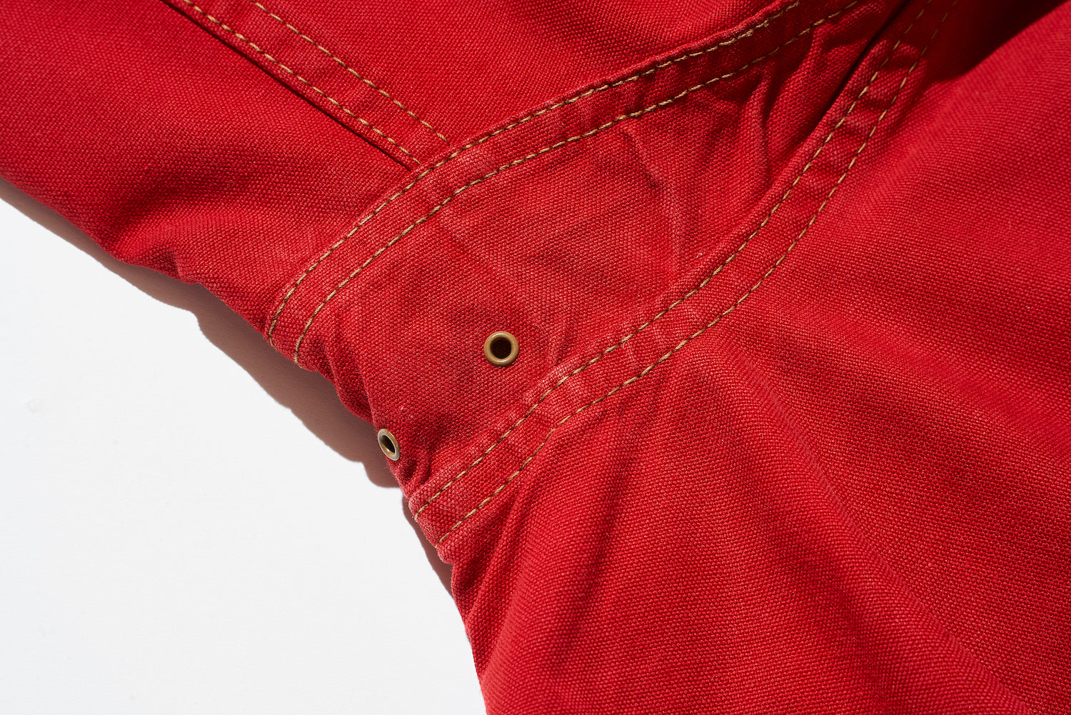 Ventilation is provided under the arms for breathability, and action pleats are used to improve mobility.