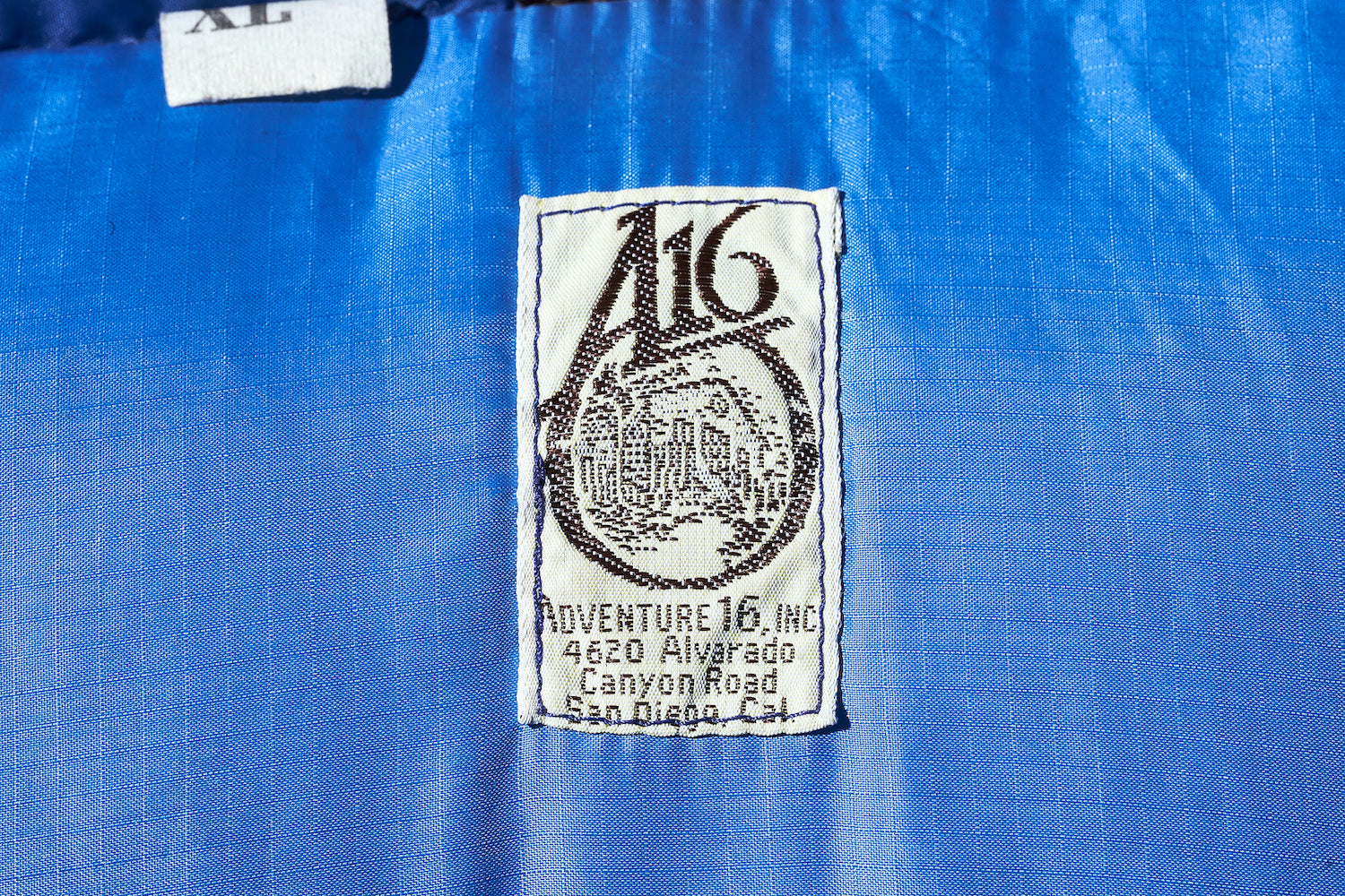 The tag of Adventure Sixteen, a prestigious San Diego brand that is still talked about as legendary today.