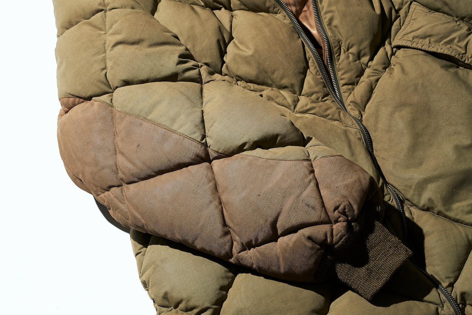 Duck fabric is applied over oiled cotton at the elbows for reinforcement.