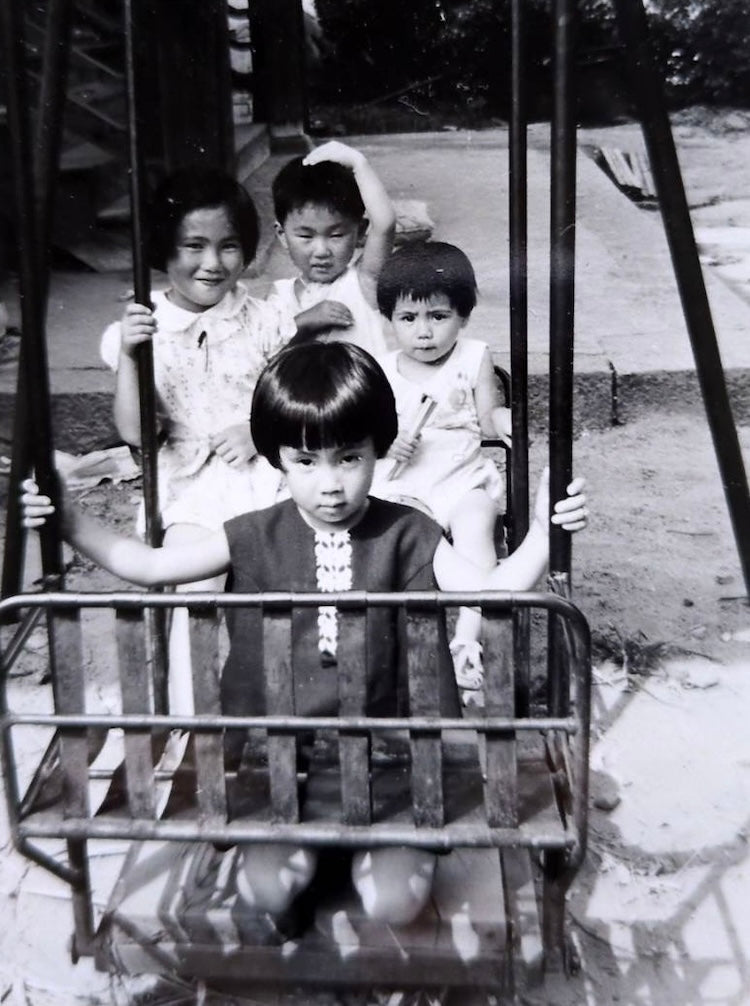 The photo was taken with relatives when he was probably 2 or 3 years old, with Wakatsuki in the middle in the back, on a swing in the grounds of his family home.