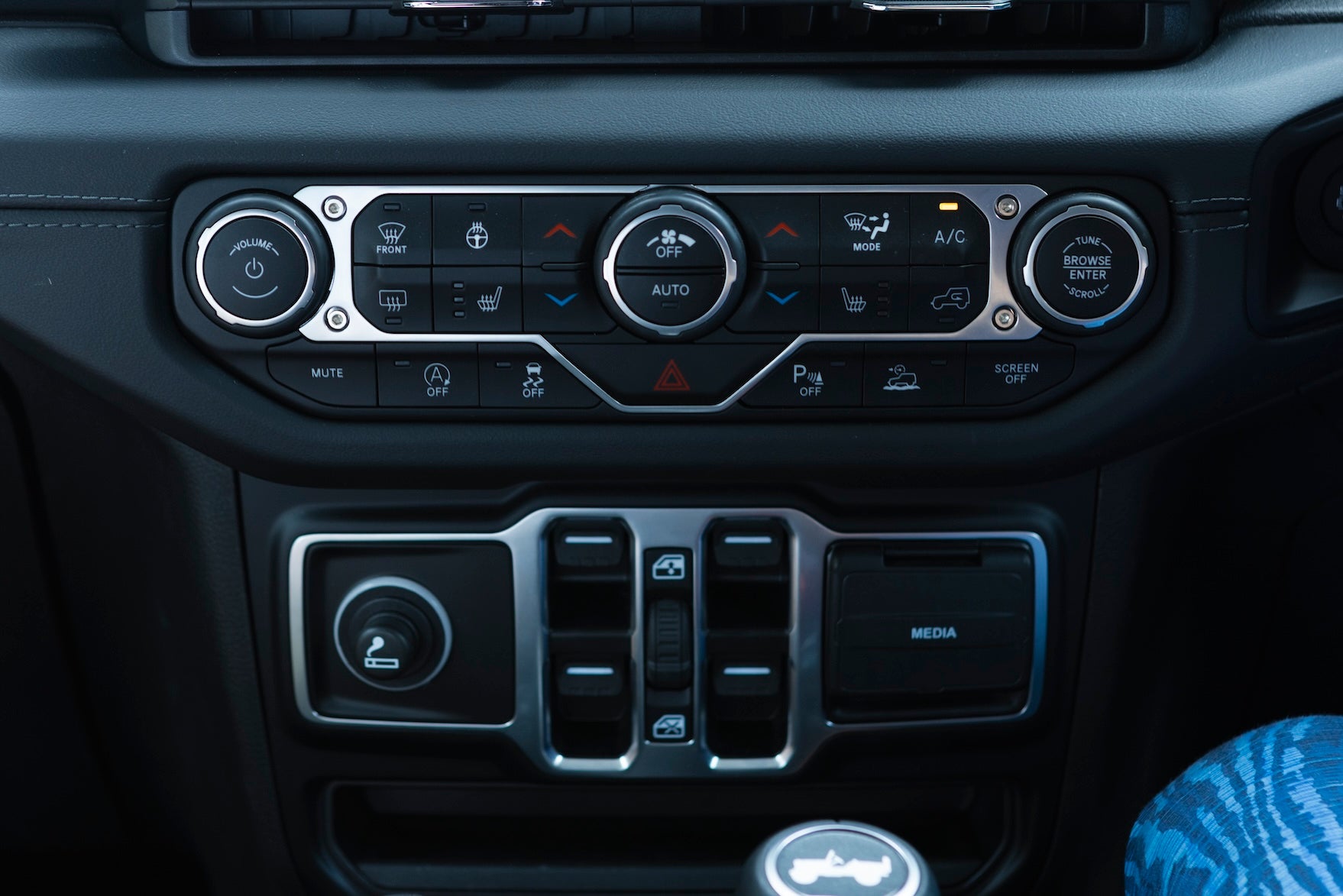 The power window switches, which are usually located on the doors, are in the center of the Wrangler, so you don't have to worry about your elbow hitting them and causing a nasty bang.