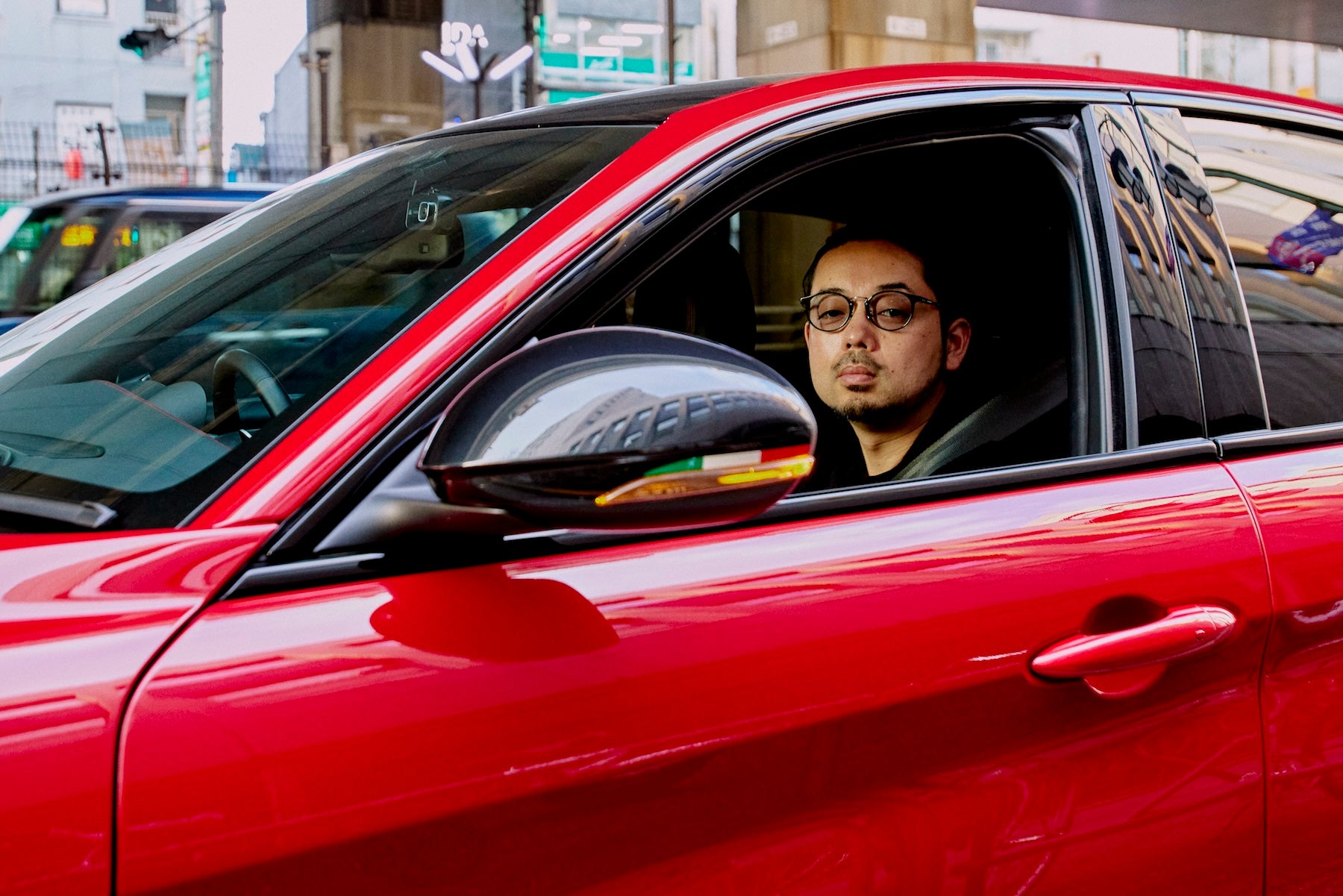It features gloss black exterior mirror housings decorated with the Italian flag.
