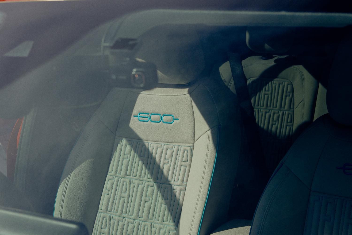 The seats are made of eco-leather. The FIAT logo and blue embroidery create a stylish and cute atmosphere.