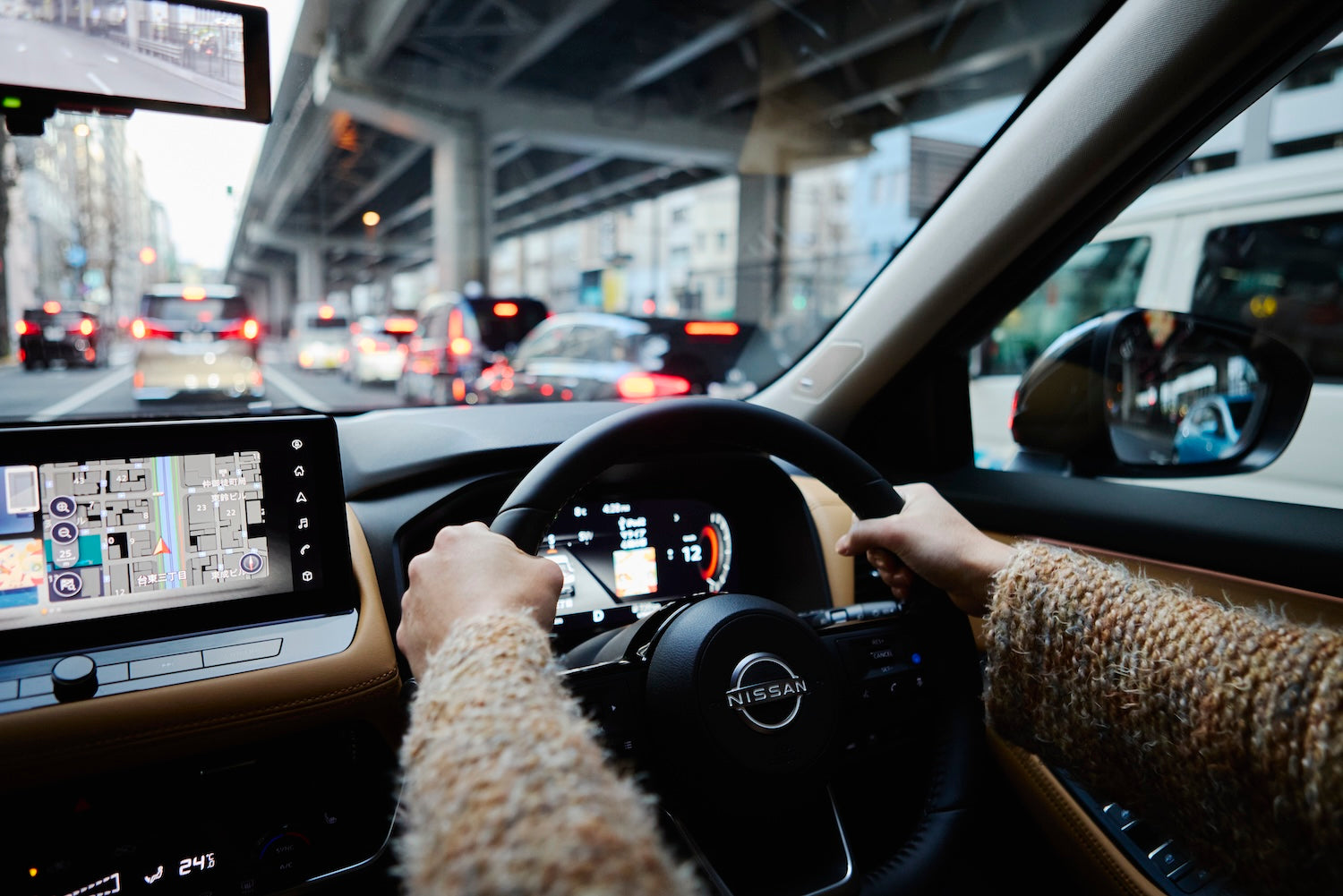 The steering wheel is wrapped in genuine leather, giving off a sense of luxury and quality.