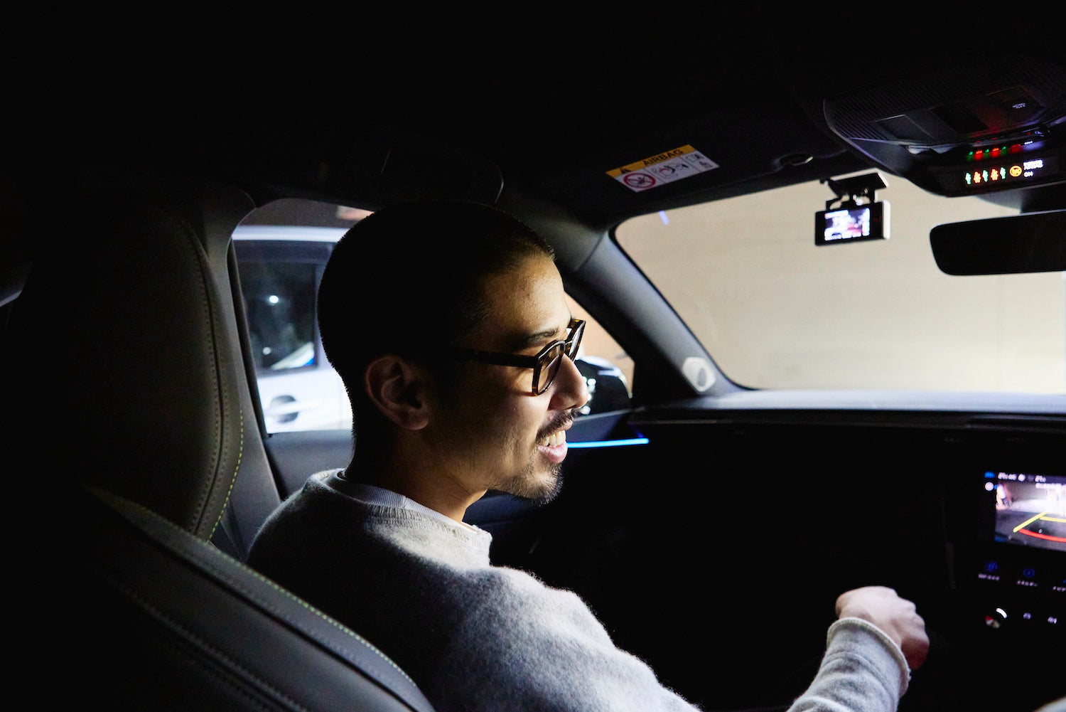 Yuya's trademark is his glasses. He spoke to me from the passenger seat in a pleasant, calm voice.